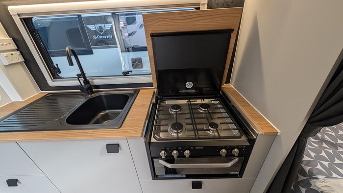 2025 New Age Caravans 19' Big Red Slide Out Save $11,099 Was $110,990