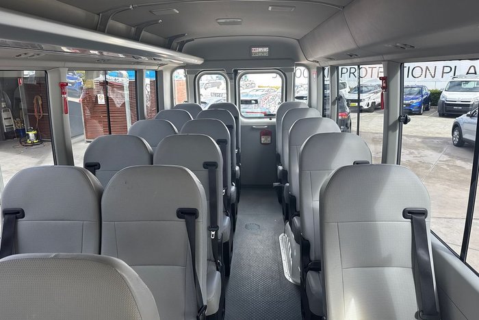 2023 Toyota Coaster GDB70R French Vanilla