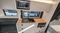 2025 New Age Caravans 19' Big Red Slide Out Save $11,099 Was $110,990