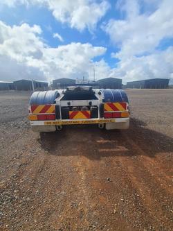 2005 Barker Tri/A Rollback Skel Trailer