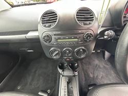 2010 Volkswagen Beetle BlackOrange 1Y MY10 Black