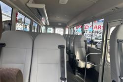 2023 Toyota Coaster GDB70R French Vanilla