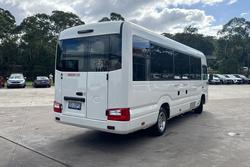 2023 Toyota Coaster GDB70R French Vanilla