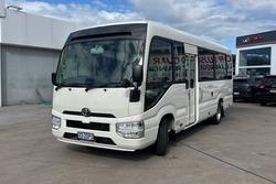 2023 Toyota Coaster GDB70R French Vanilla
